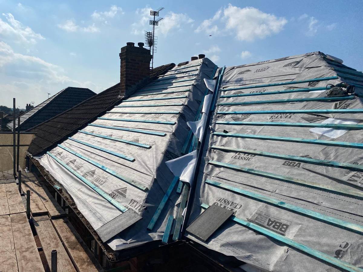 Pitched tiled roof during installation